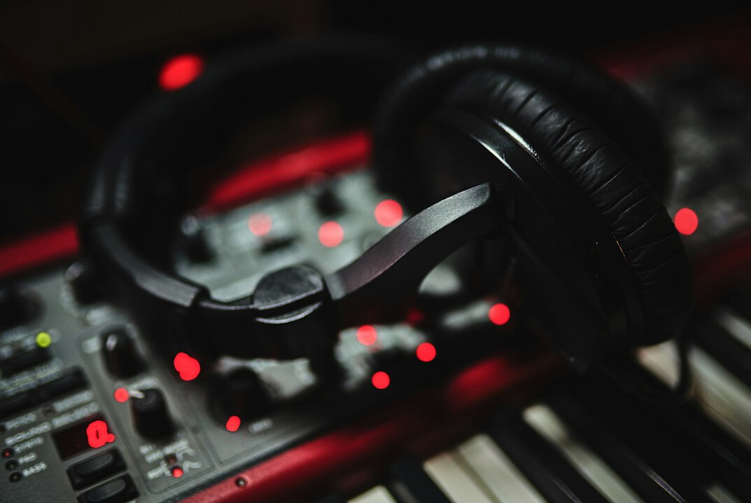 Audio mixing console with headphones for sound design